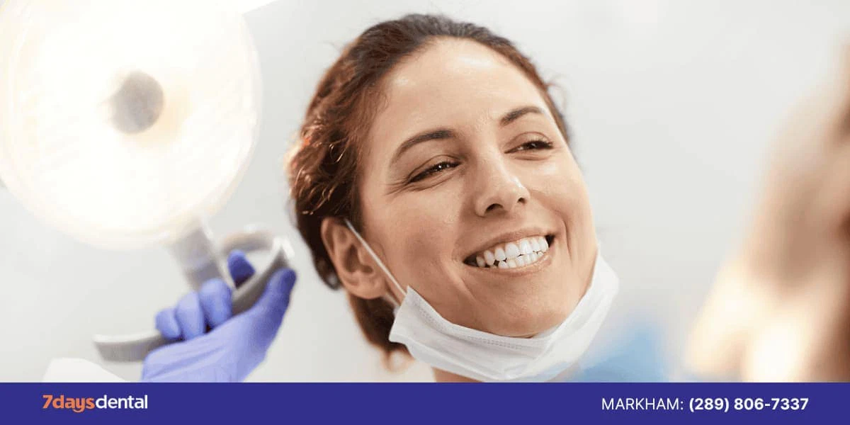 Happy-dentist-looking-at-patient