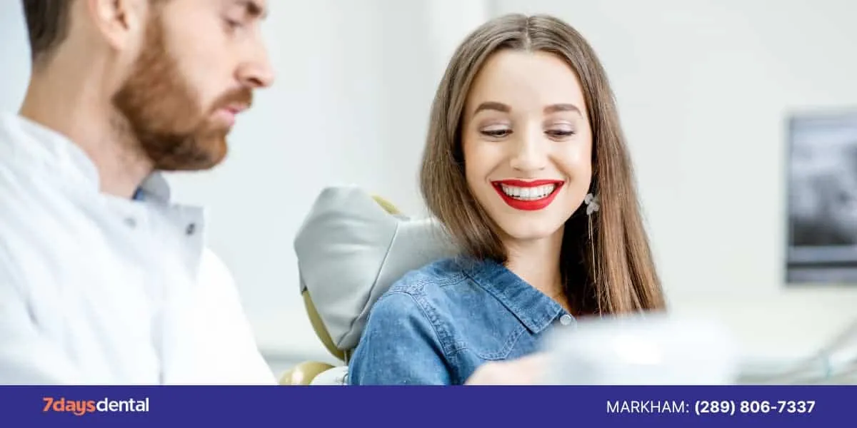 A concerned patient consulting a Markham dentist at 7 Days Dental after experiencing delayed root canal pain