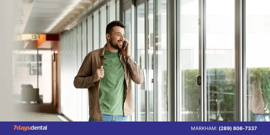 Smiling patient leaving the dental clinic after a positive experience