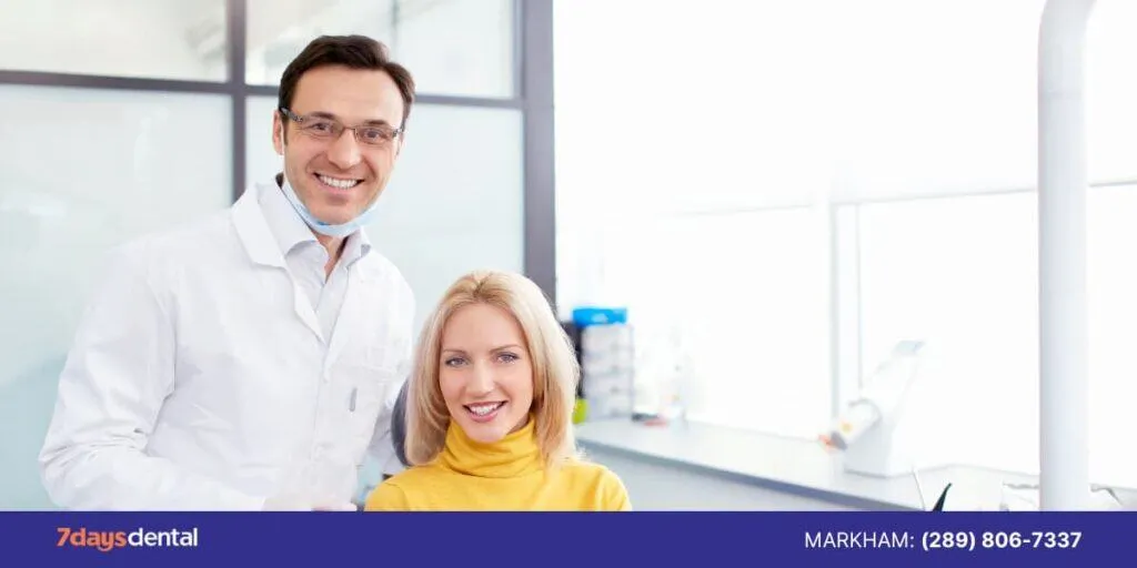 Friendly dentist and happy patient